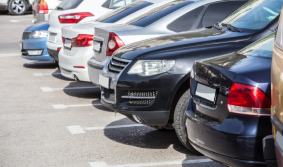 Cars parked in parking spaces of a car park