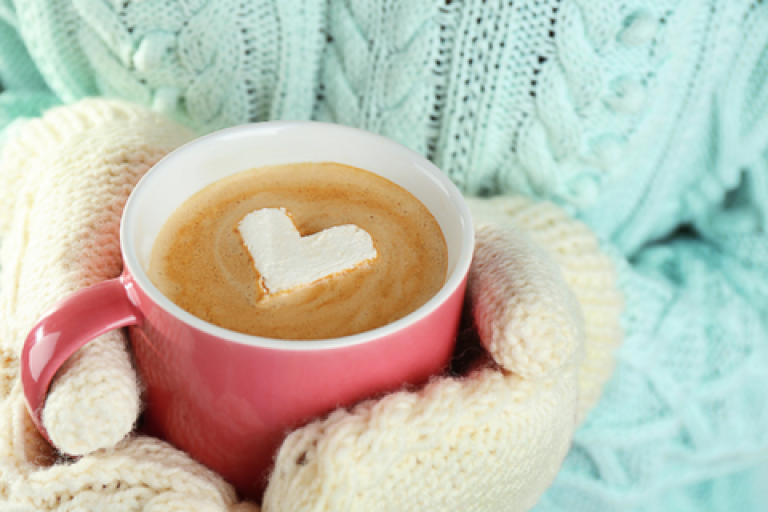 Hands holding a hot drink