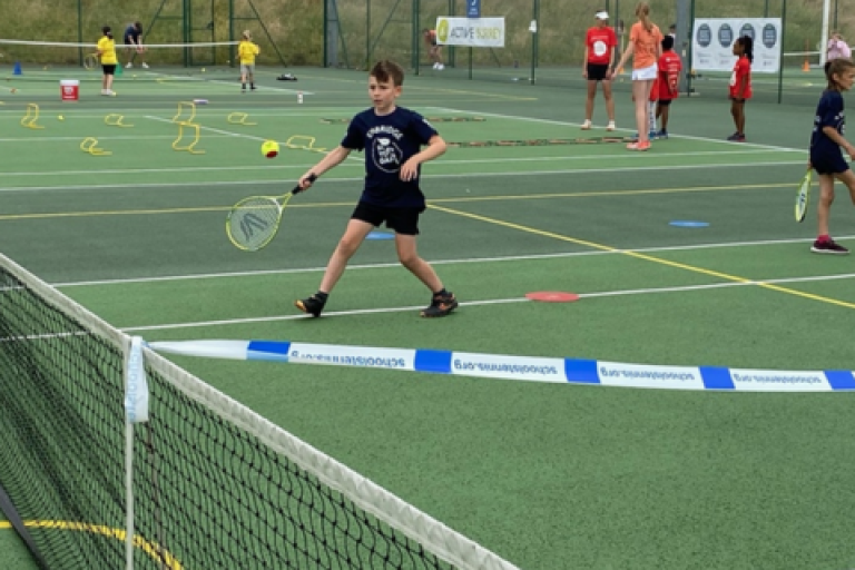 Young boy playing tennis in the Surrey Youth Games