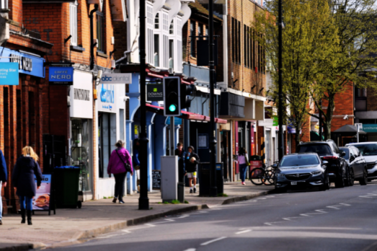 People walking along Cobham high street