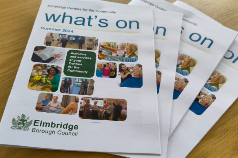 Stack of Centre's activity booklets with title 'What's on' 