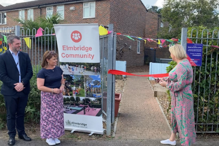 Police Crime Commissioner cutting ribbon to open community garaden