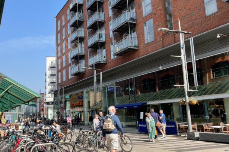 Bike racks and shoppers in The Heart shopping centre, Walton-on-Thames
