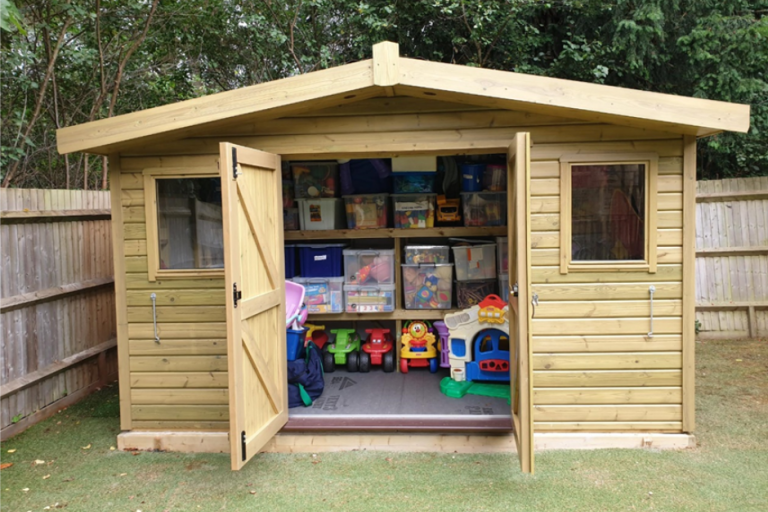 New, large shed with double doors open showing the storage contents