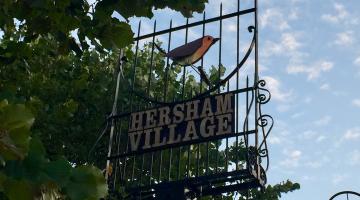 hersham village sign with robin