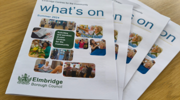 Stack of Centre's activity booklets with title 'What's on' 