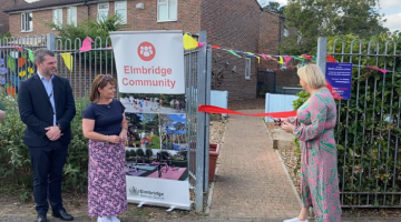 Police Crime Commissioner cutting ribbon to open community garaden